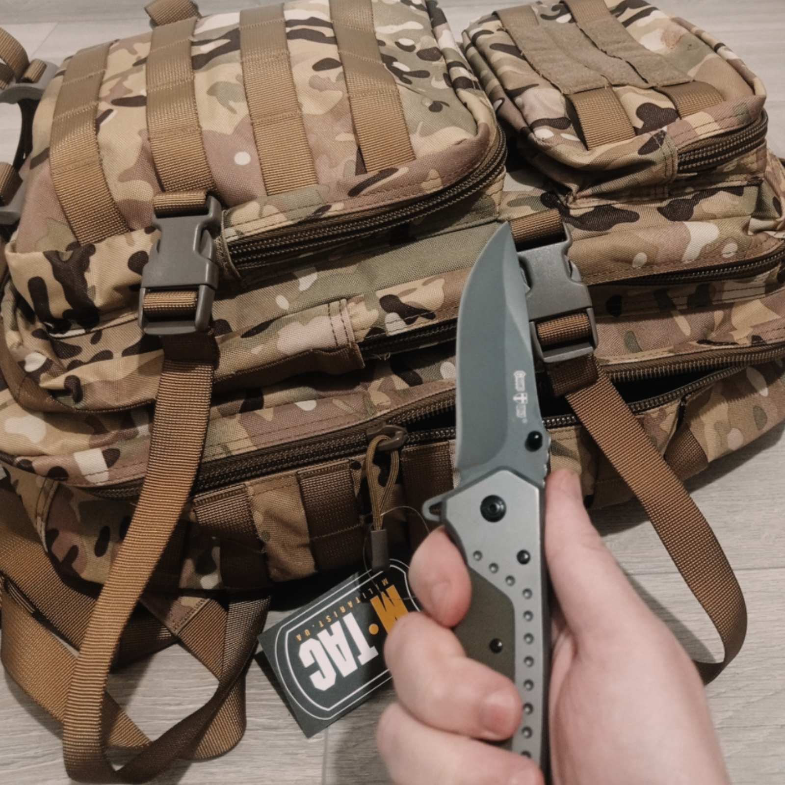 Tactical backpack and folding knife - durable, lightweight, and built for survival, training, or outdoor adventures without compromise.